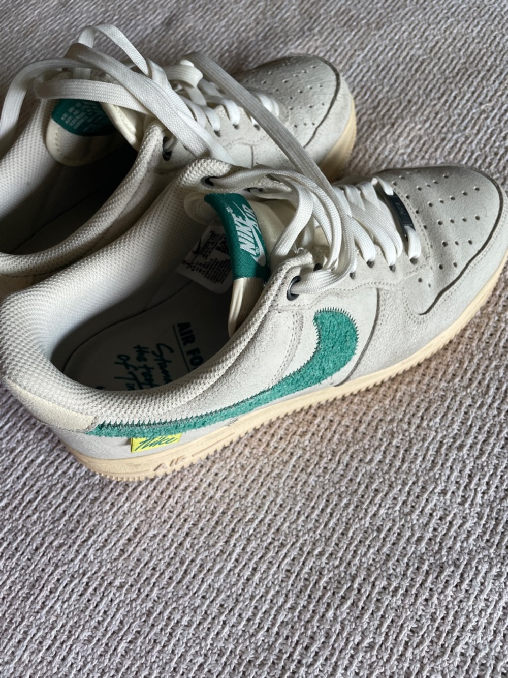 Nike Low-Top Sneaker in Cream with Teal Swoosh